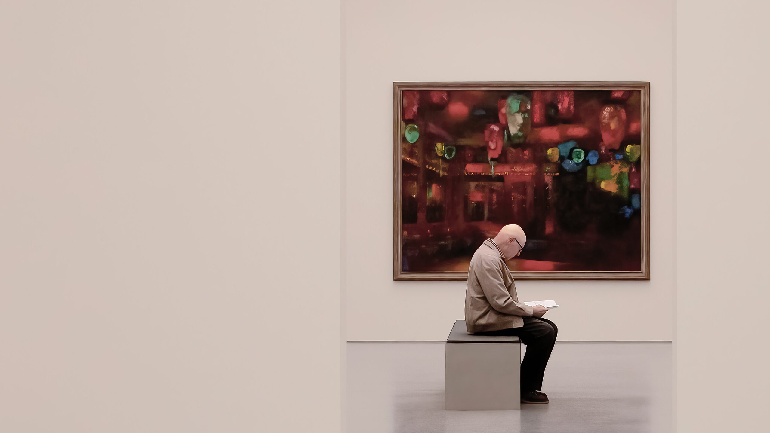 Art investor contemplates a painting in a gallery. Photo by Ricardo Gomez Angel on Unsplash