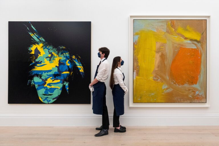 Technicians present (L) ?Self Portrait?, 1986, by Andy Warhol (Est. $15-20 million) and ?Untitled?, 1961, by Willem de Kooning (Est. $7-10 million). Preview of works from the Macklowe Collection, the most valuable collection of Modern & Contemporary art to appear on the market. 29 more works from this collection, currently on display at Sotheby?s New Bond Street, will be offered for sale by Sotheby?s New York in Spring. Credit: Stephen Chung / Alamy Live News