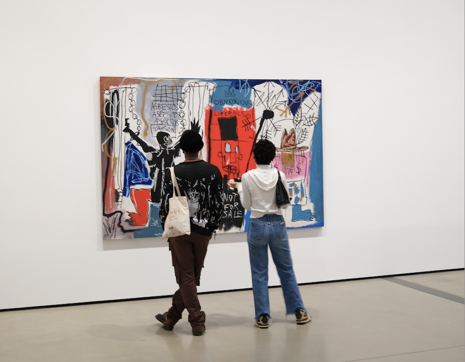 Potential art investors admire blue chip artist Jean-Michel Basquiat. Photo by Mike Von on Unsplash
